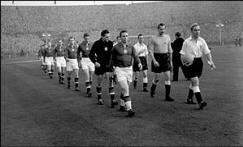 Ferenc Puskas and Billy Wright lead out Hungary and England in 1954